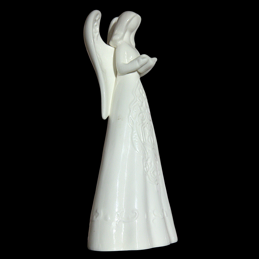 A white ceramic angel figurine with outstretched wings and a long gown, shown against a solid black background.