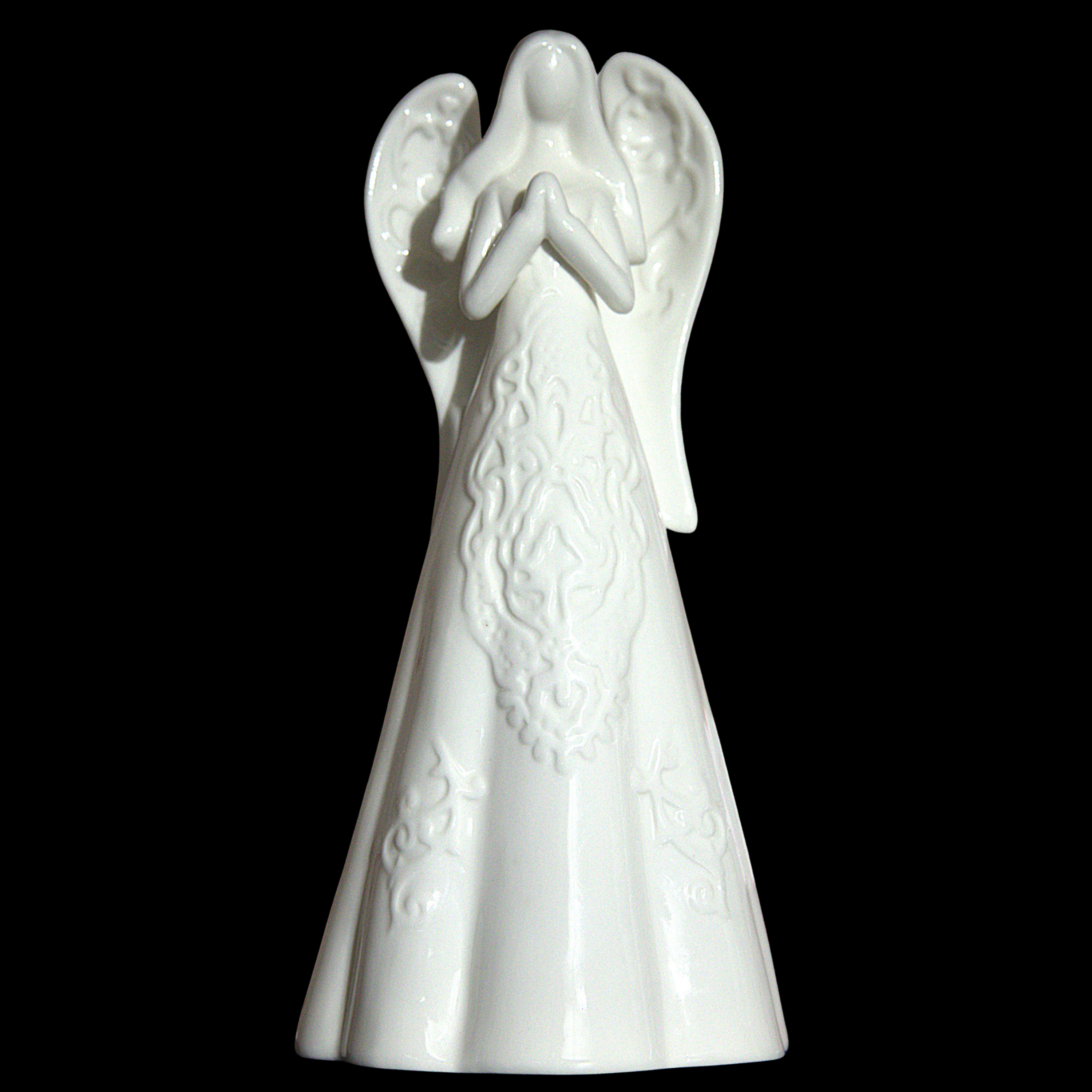 A white ceramic angel figurine with outstretched wings and a long, textured robe, set against a solid black background.