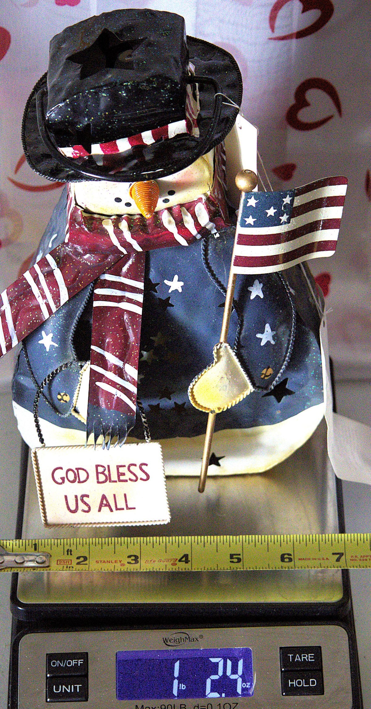 Vintage hand-painted patriotic snowman tea light lantern featuring red, white, and blue Americana Christmas décor with festive winter holiday charm.