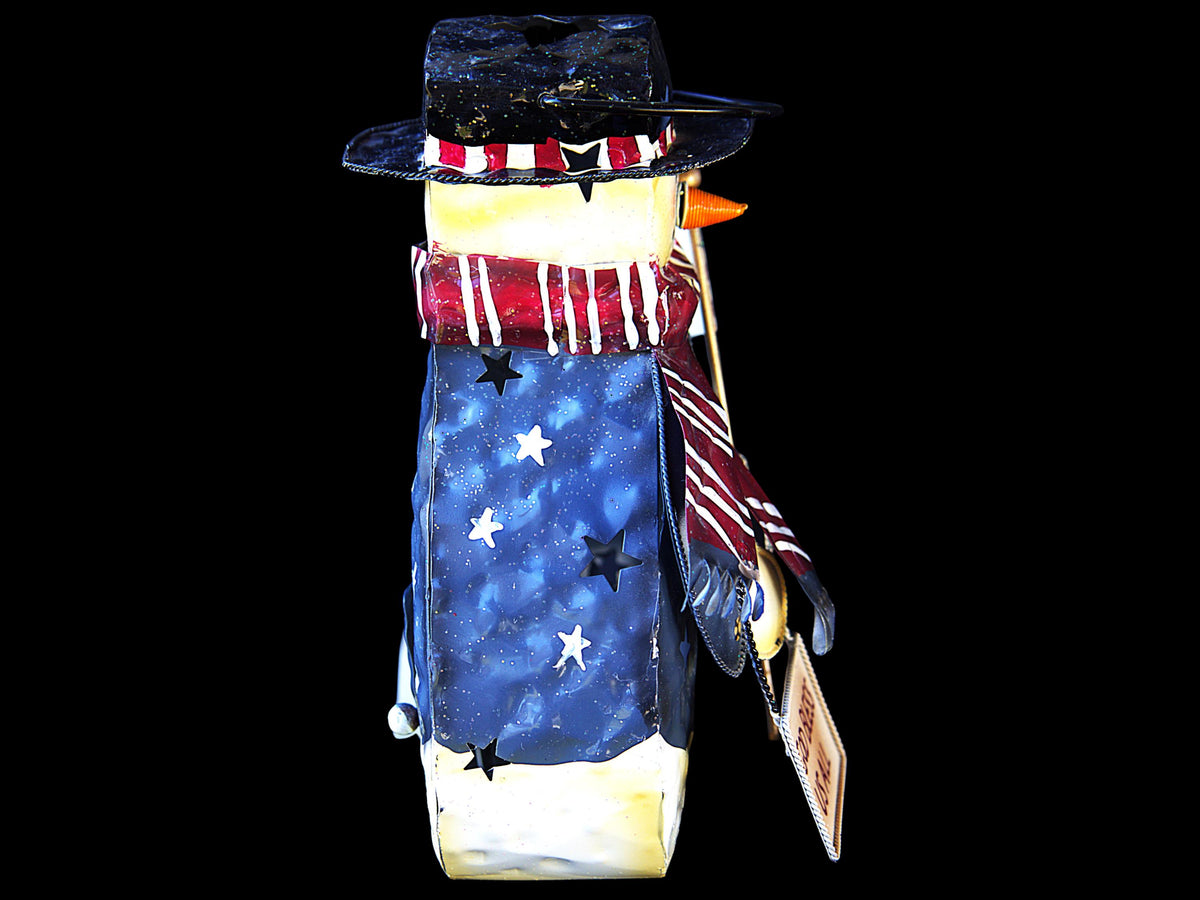 Vintage hand-painted patriotic snowman tea light lantern featuring red, white, and blue Americana Christmas décor with festive winter holiday charm.
